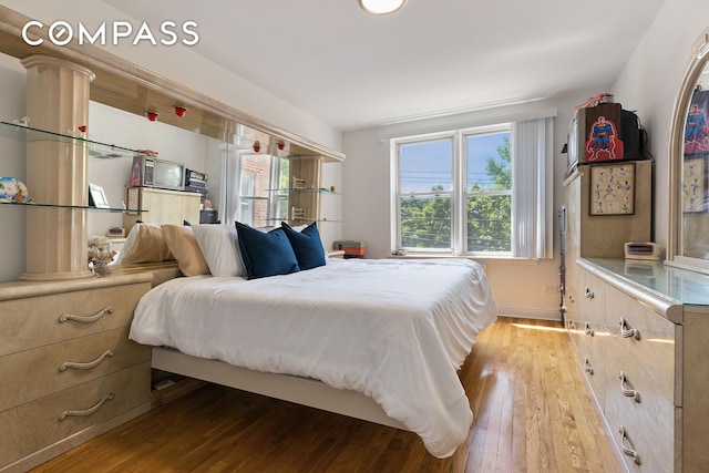 bedroom featuring hardwood / wood-style flooring