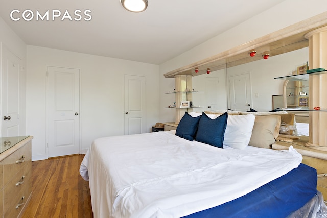 bedroom featuring wood finished floors