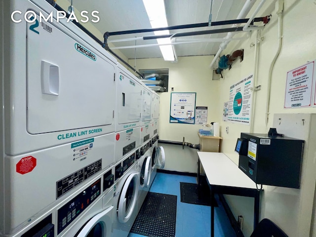 communal laundry room featuring stacked washing machine and dryer and washing machine and dryer