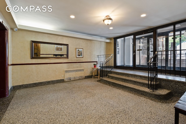 lobby featuring recessed lighting and stairs