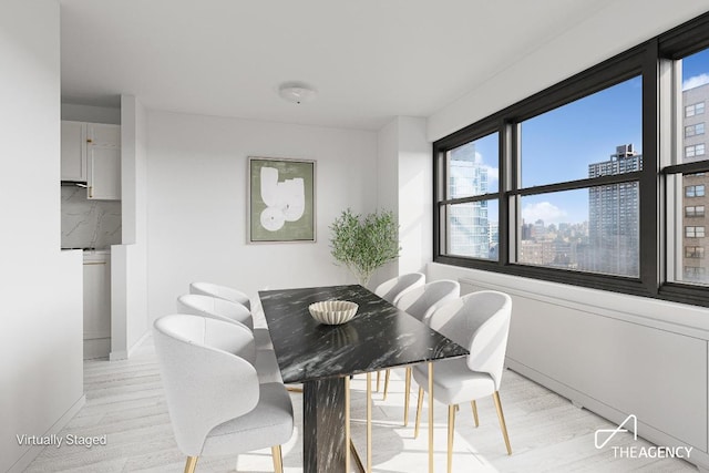 dining room featuring light hardwood / wood-style flooring