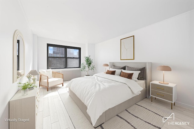 bedroom with light hardwood / wood-style floors