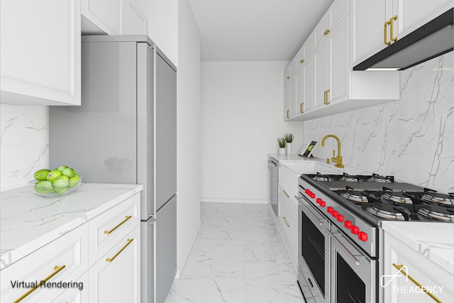 185 W End Ave Unit 25H, New York City, NY 10023 - kitchen featuring stainless steel range, light marble finish floors, freestanding refrigerator, under cabinet range hood, and white cabinetry