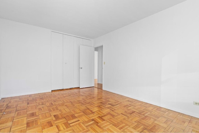 unfurnished room featuring light parquet flooring