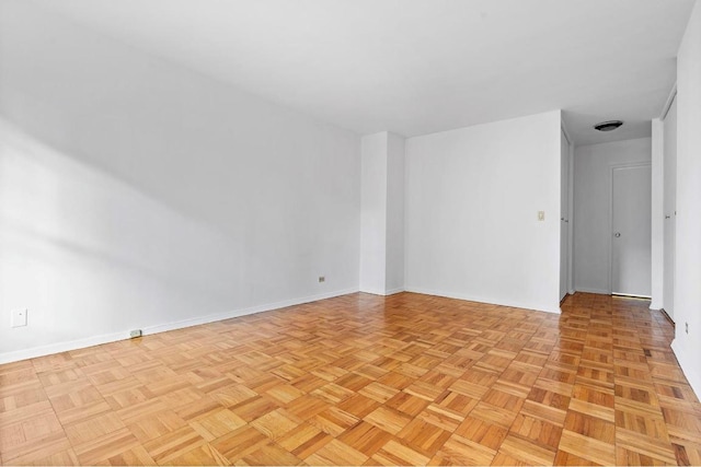 spare room with light parquet flooring