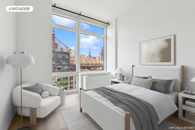 bedroom with light hardwood / wood-style flooring