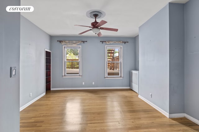 spare room with ceiling fan and light hardwood / wood-style floors