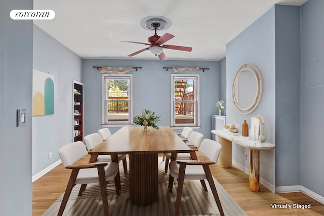 dining room with visible vents, ceiling fan, baseboards, and light wood-style floors