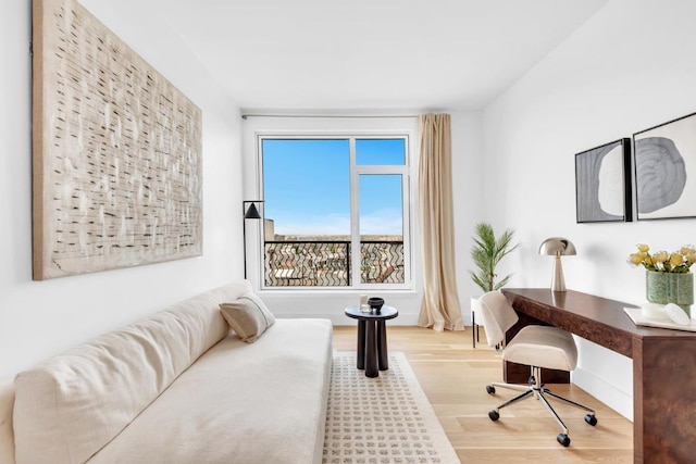 bedroom with hardwood / wood-style flooring