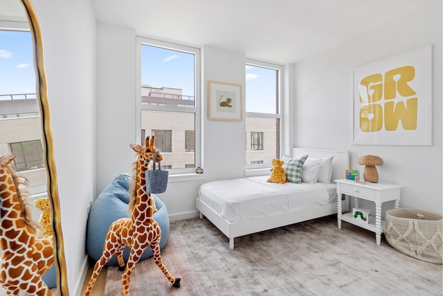 bedroom featuring baseboards