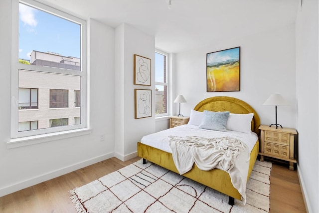 bedroom with light hardwood / wood-style floors