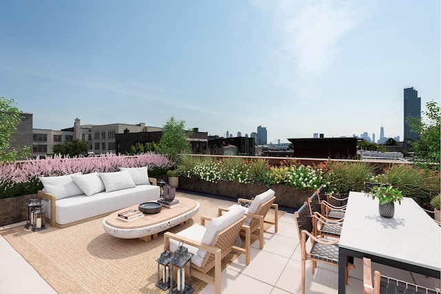 view of patio with a city view and an outdoor hangout area