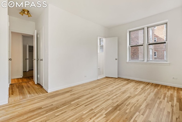 unfurnished room featuring light hardwood / wood-style flooring