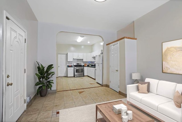 living room with light tile patterned flooring