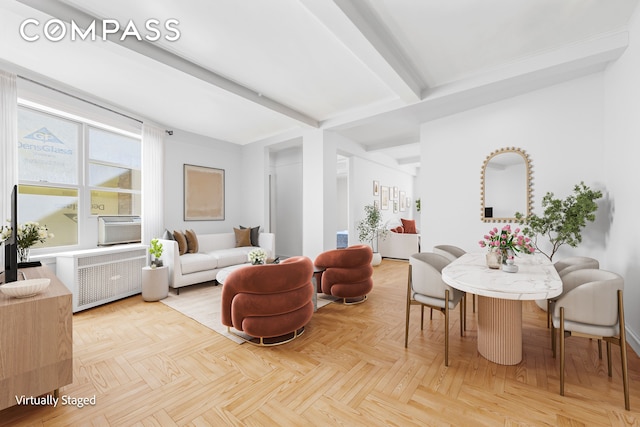 living area featuring beam ceiling and radiator