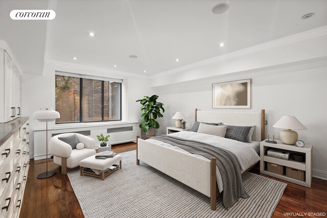 bedroom featuring ornamental molding and wood-type flooring