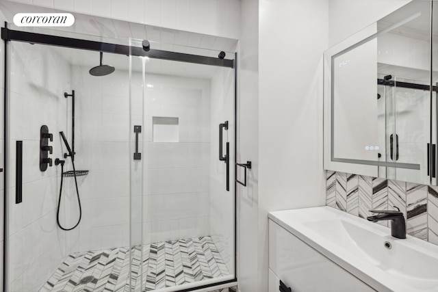 301 E 52nd St Unit 2B, New York City, NY 10022 - full bathroom with backsplash, a stall shower, and vanity