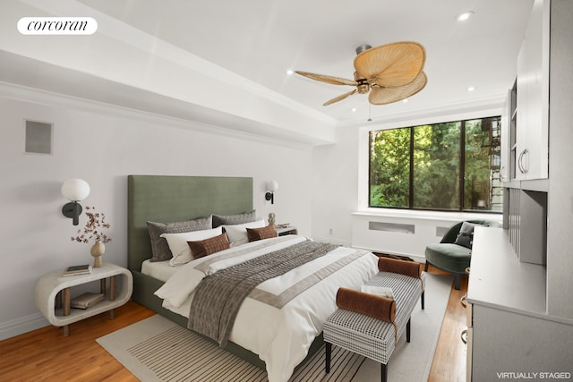 301 E 52nd St Unit 2B, New York City, NY 10022 - bedroom with light wood finished floors, crown molding, recessed lighting, and ceiling fan