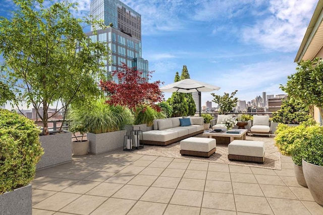 view of patio featuring a view of city and an outdoor living space