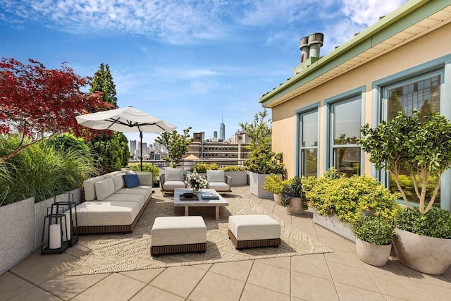 view of patio / terrace featuring a view of city and outdoor lounge area