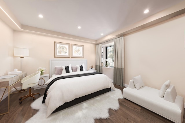 bedroom with recessed lighting, baseboards, and wood finished floors