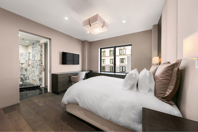 bedroom featuring recessed lighting and wood finished floors