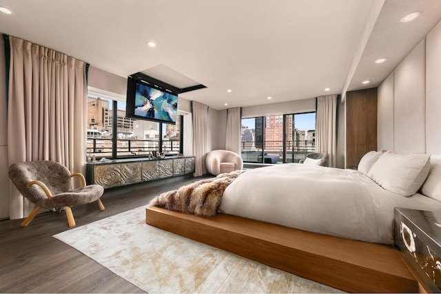 bedroom featuring recessed lighting and wood finished floors