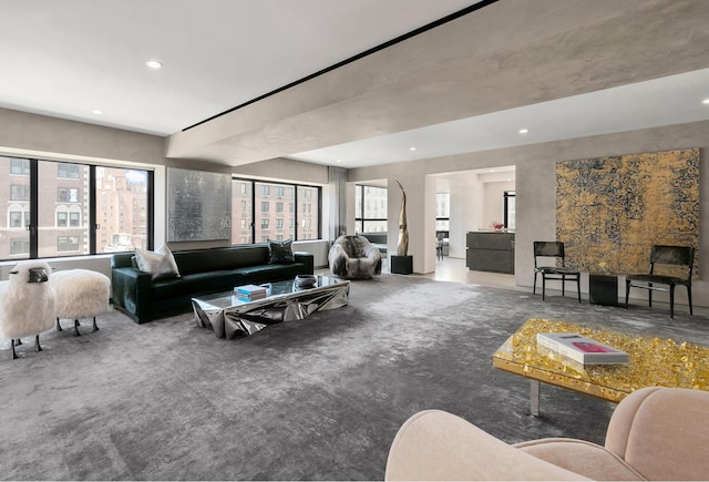 carpeted living area with recessed lighting and a healthy amount of sunlight