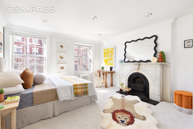 bedroom featuring crown molding, carpet floors, and radiator