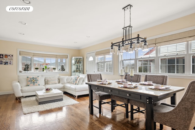 dining area featuring baseboards, visible vents, ornamental molding, wood finished floors, and recessed lighting