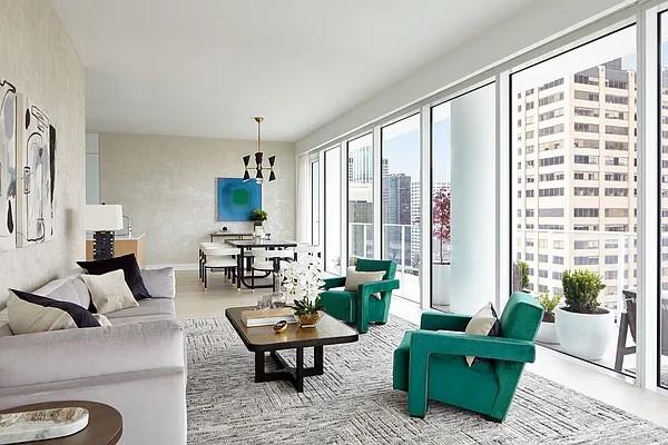 living room featuring a city view and a notable chandelier