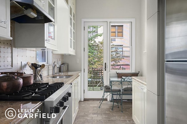 kitchen featuring sink and white cabinets