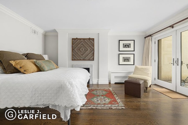 bedroom with ornamental molding, access to outside, and french doors