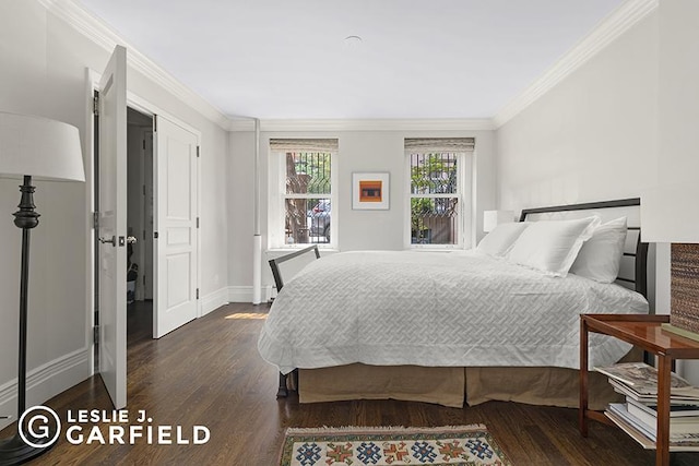 bedroom with dark hardwood / wood-style flooring and crown molding