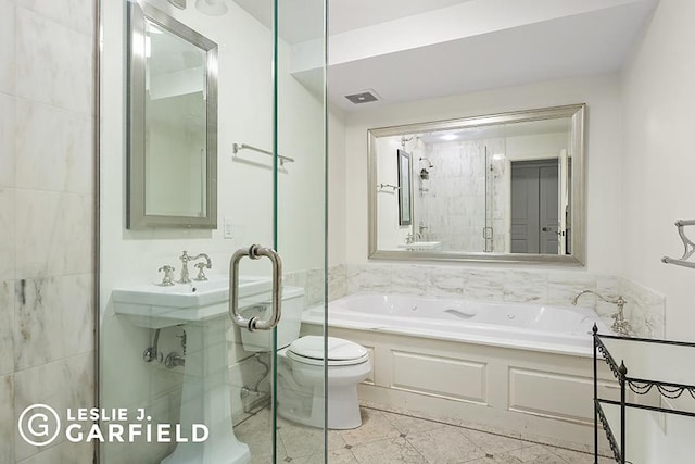 bathroom with tile patterned flooring, toilet, and plus walk in shower