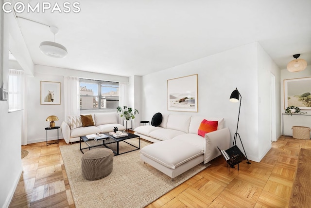 living room featuring parquet floors