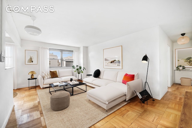 living room featuring baseboards