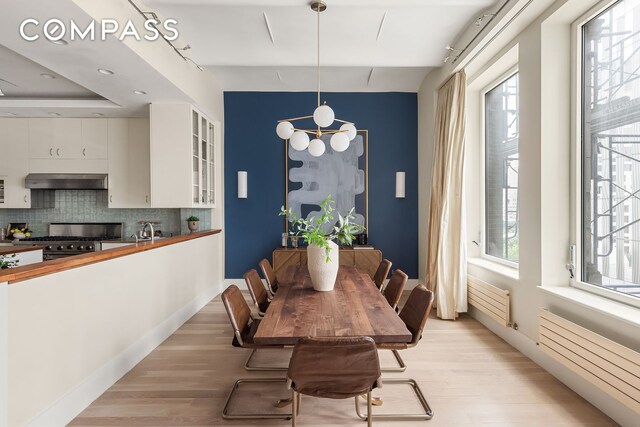 114 Liberty St Unit 7, New York City, NY 10006 - dining space featuring light wood finished floors
