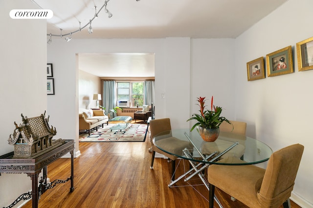 4 Bogardus Pl Unit 3E, New York City, NY 10040 - dining space with wood finished floors and track lighting