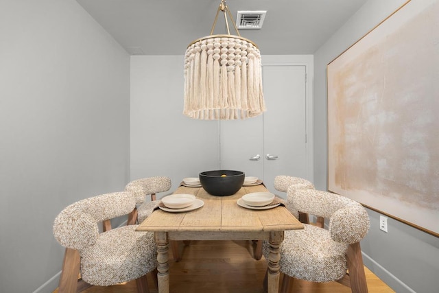 dining area featuring wood-type flooring