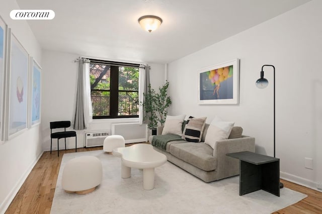 240 E 30th St Unit 3A, New York City, NY 10016 - living area with wood finished floors and an AC wall unit