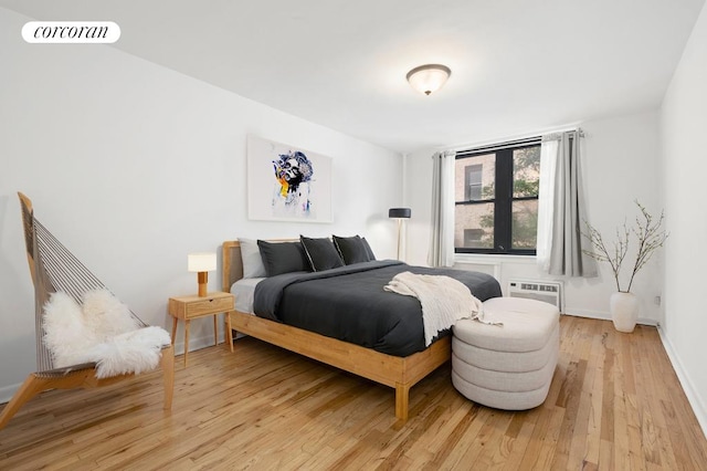 240 E 30th St Unit 3A, New York City, NY 10016 - bedroom with light wood-style flooring and a wall unit AC