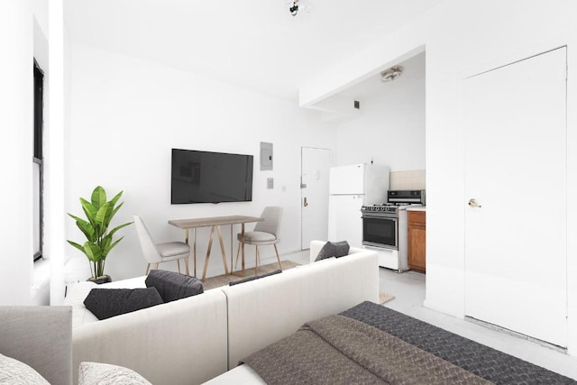 living room with beam ceiling