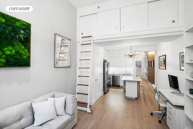 office featuring visible vents, a chandelier, and light wood finished floors