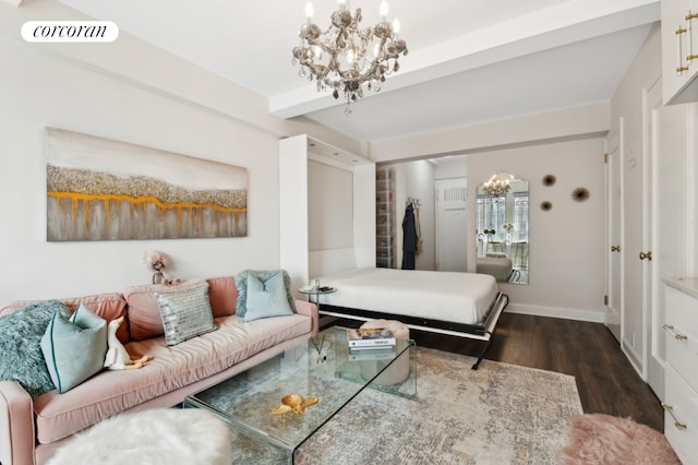 bedroom with dark hardwood / wood-style floors, beamed ceiling, and an inviting chandelier