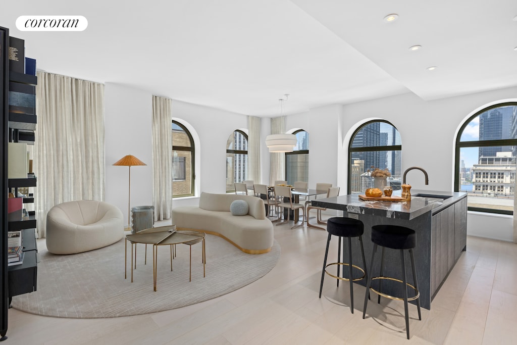 living area featuring visible vents and recessed lighting