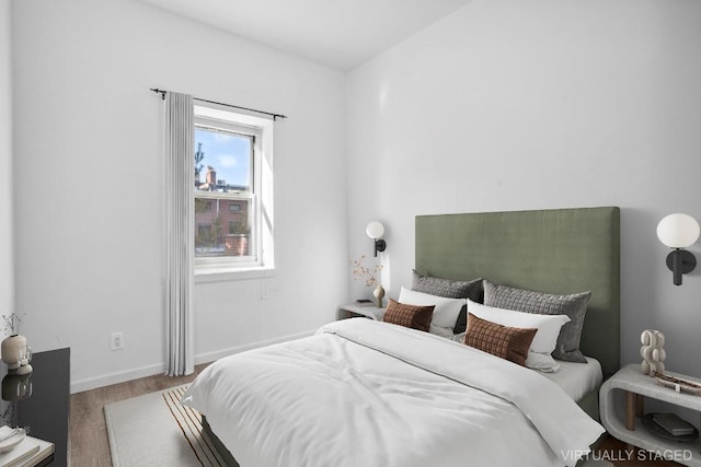 bedroom with hardwood / wood-style floors