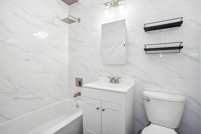 kitchen featuring sink, stainless steel appliances, light stone countertops, white cabinets, and light wood-type flooring