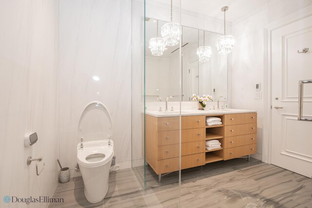 bathroom with a chandelier, crown molding, wood walls, and vanity