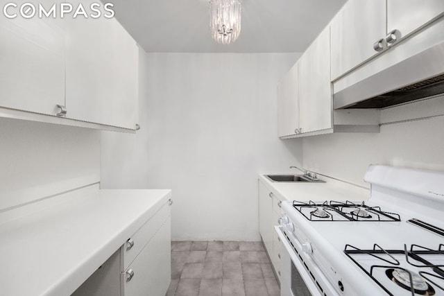 kitchen with white cabinetry, extractor fan, a chandelier, white gas range oven, and sink